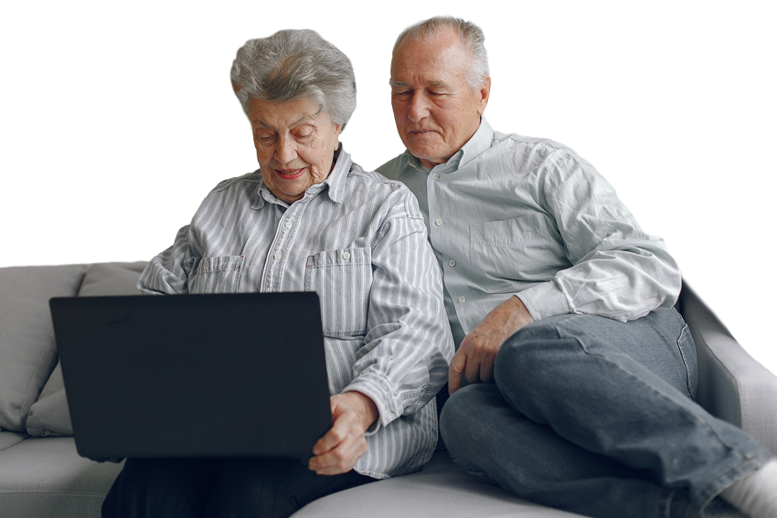 elegant-old-couple-sitting-at-home-and-using-a-lap-F4Q5HUG
